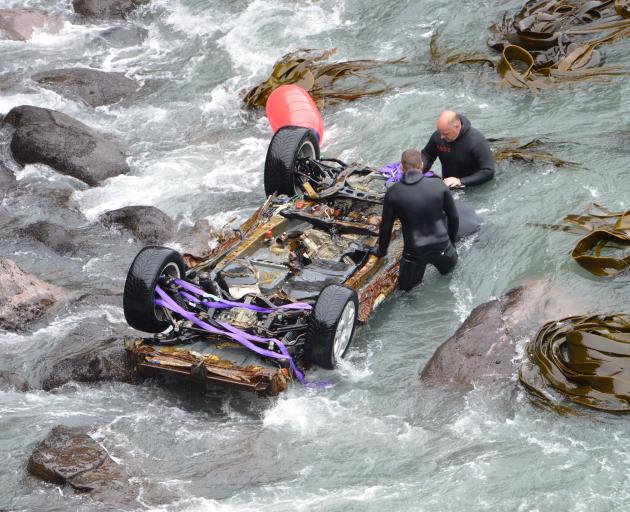 Police recover John Beckenridge’s car from Blue Cod Bay in the Catlins on May 6, 2015. Photo:...