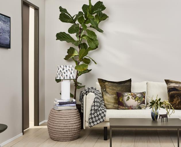 The subtle blue of the wall in this living room adds enough colour for personality without...