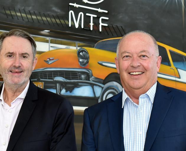 Outgoing MTF Finance chairman Mark Darrow (left) and acting chairman Noel Johnston catch up in...