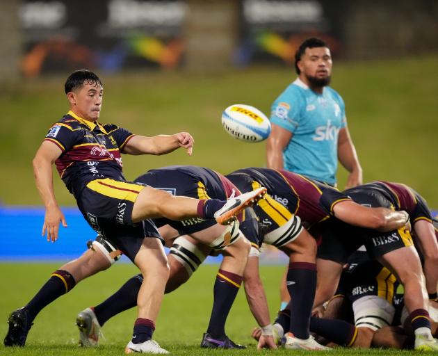 Highlanders halfback Nic Shearer puts in a clearing kick during his Super Rugby debut against...