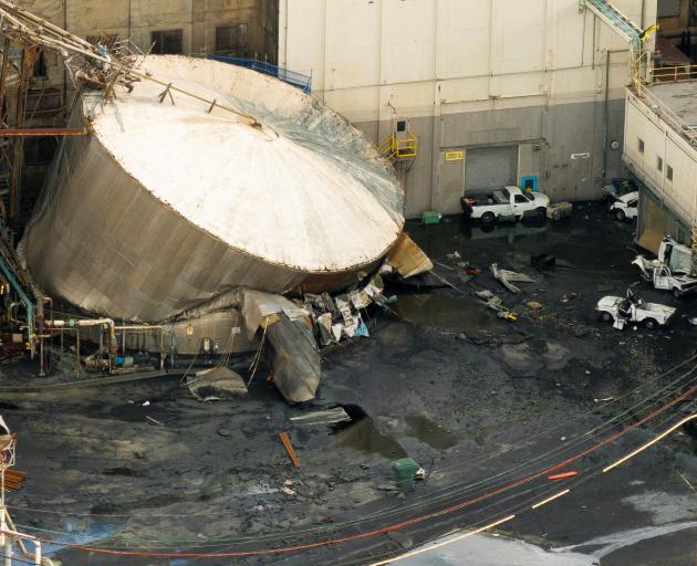 The ruptured chemical tank at the Nippon Dynawave Packaging pulp and paper mill in Longview,...