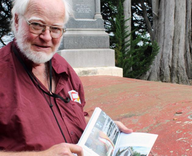 Lloyd Esler with his new book at what he called the ‘‘shabby mausoleum’’. PHOTO: TAYLER MUTTON