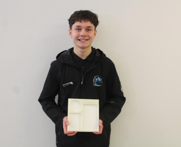 Riverton student Blaze Daane with his glow-in-the-dark nightstand caddy. PHOTO: TAYLER MUTTON