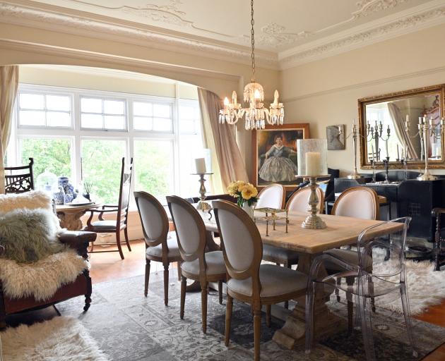 The oil painting in a corner of the dining room is a portrait of Giselle Steiner, painted by her...