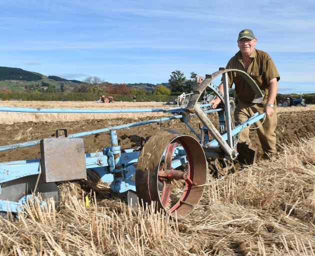 Tom Fowler operates his more than 100-year-old plough on the Taieri last year. PHOTO: ODT FILES