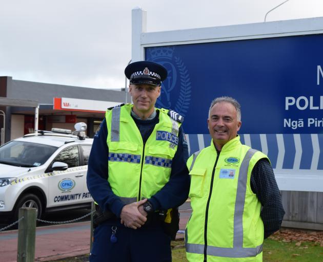 Sergeant Boyd Smart (left) and Mosgiel-Taieri Community Patrol chairman Tony Baas, both of...