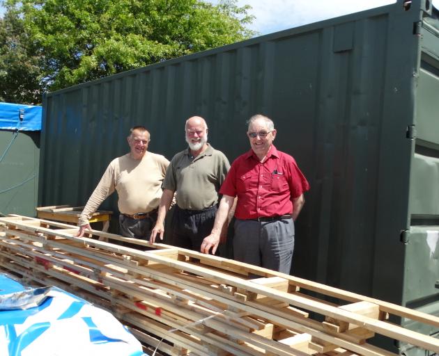 Green Island Shed members (from left) Henry Schakelaar, David Mackle, and Bruce Cromb look over...