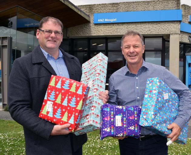 Former Mosgiel Round Table president Grant Gibson (left) and Rotary Club of Taieri member David Glen are encouraging people to put presents for children under the Mosgiel Giving Tree.PHOTO: SHAWN MCAVINUE