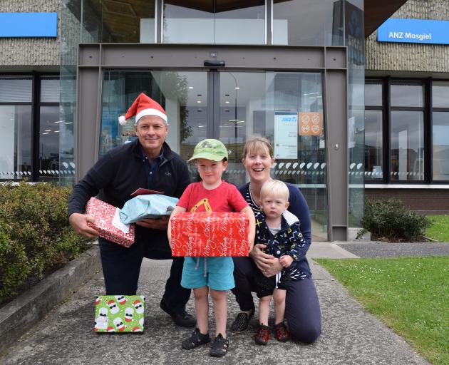 Rotary Club of Taieri member David Glen and Kelly Kleeber and her boys Cooper (3) and Ashton (1)...