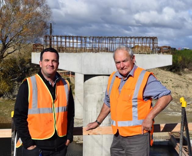 Inspecting the rebuilding of a replacement bridge near Sutton last week are Dunedin City Council...
