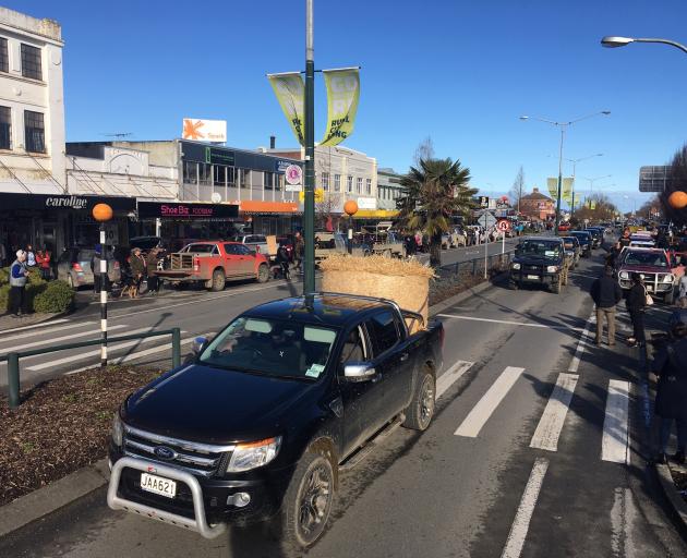 Utes drive through Gore's main street. Photo: Gerard O'Brien
