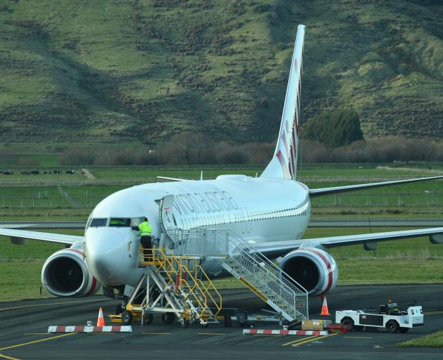 The stricken Virgin aircraft still on the tarmac at Dunedin airport this morning. Photo: Stephen Jaquiery