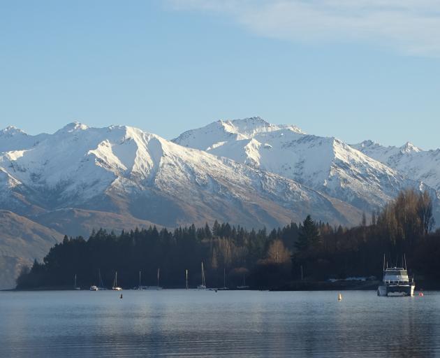 Morning sun hits Eely Point - a popular, sheltered boating and picnicking area near Wanaka on a...