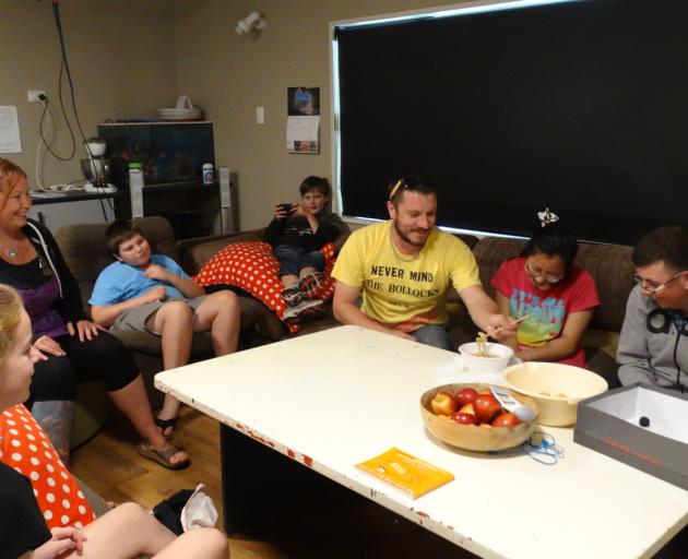 Enjoying a movie and noodles at the Kahu Youth Trust’s ‘‘the crib’’ are (from left) Kate Goodsell...