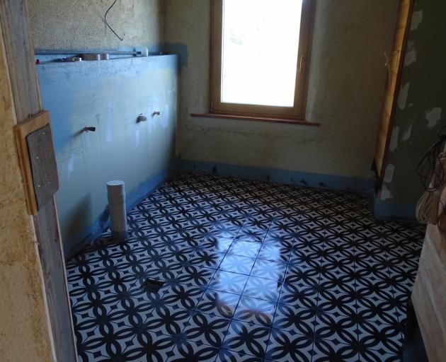 The bathroom will look like any other bathroom but the walls will be made of straw.
