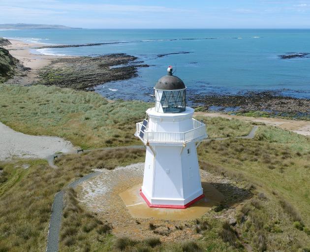 The Waipapa lighthouse looks out over the Waipapa Point reef. Below: The reef on which the...