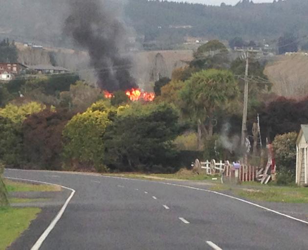 A house in Orokonui Rd was well alight when fire crews arrived. PHOTO: HAMISH RENNIE 
