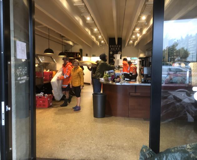People clear out items and furniture from Big Fig in Wanaka this morning. Photo: Kerrie Waterworth People clear out items and furniture from Big Fig in Wanaka this morning. Photo: Kerrie Waterworth