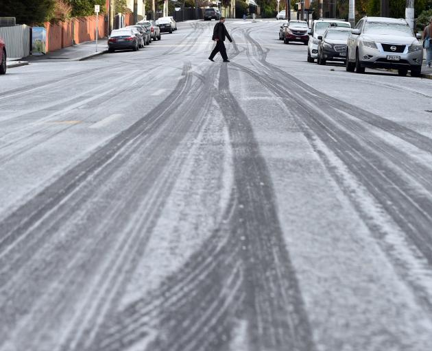 A person walking across Ross St during icy conditions on the Dunedin suburbs on Sunday morning....