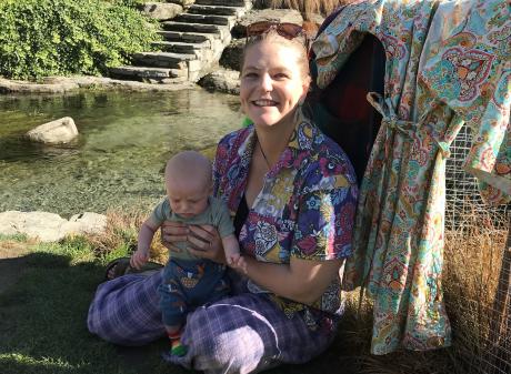 Wānaka fashion creative Jess Rasmussen, 34, holds her son Finn. She is wearing her own...