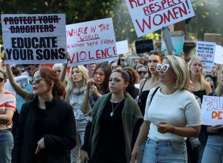 Demonstrators take part in a national rally against violence against women in the Sydney central...