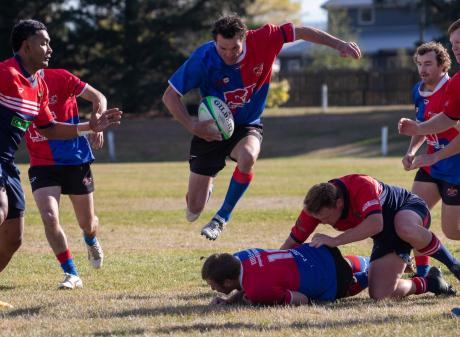 Maniototo centre Quinton Smith skips away from the Cromwell defence during the Central Otago...