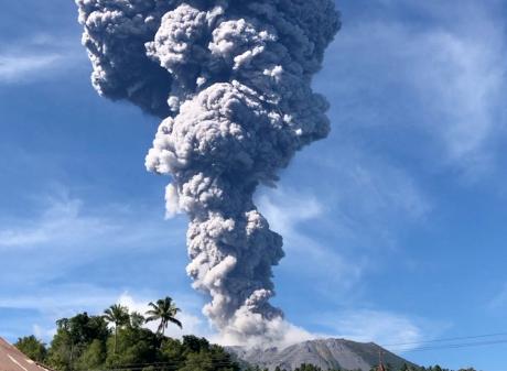 A column of ash rises over the Mount Ibu volcano, in Tabaru, North Maluku province on Monday....