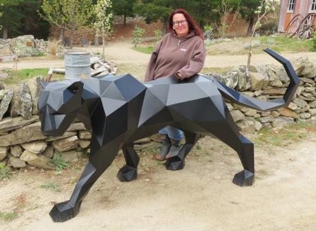 Art on the Goldfields organiser Tracy Stroud stands beside Silent Grace, by Leroy Spijkerbosch,...
