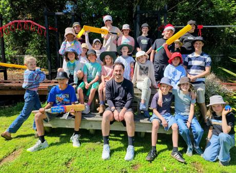 Gathering with Broad Bay School pupils and teacher Daniel Ashton is cricket stalwart Hamish...