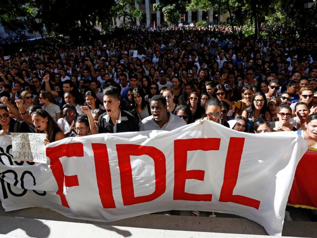 Students of Havana University pay tribute to Cuba's late President Fidel Castro as they march to...