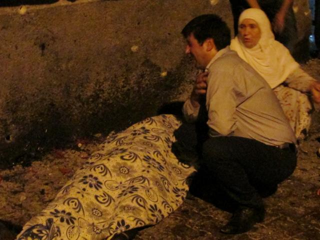 A man and woman mourn one of the victims at the wedding ceremony. Photo:Reuters 