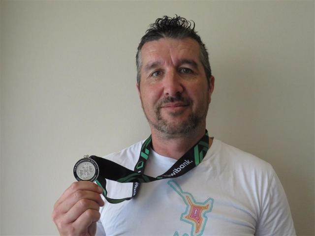 Reon Blake with his 2024 Kiwibank Local Hero Award medal. Photo: Supplied