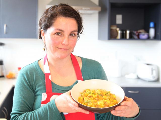 Carolina Gomez and her Chilian dish charquican. Photo: Craig Baxter
