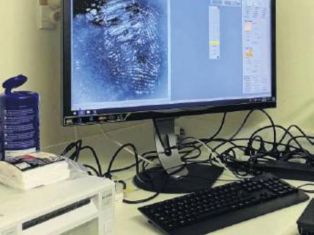 2021 technology meets fingerprints saved and stored from 1921.