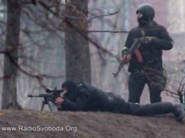 A sniper fires from a fortified position in the direction of protesters in Kiev. REUTERS/Radio Free Europe/Radio Liberty