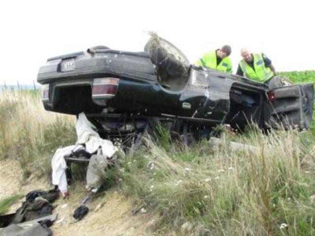Constable John Dunn (left) and Senior Constable Trevor Buchanan, of the Southern Region serious crash unit, investigate yesterday's fatal accident. Photo by Sarah Marquet.