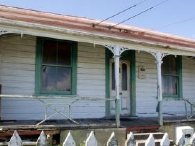 The house is likely to attract buyers who want to remove it and build on the 381sq m section. Photo: NZ Herald