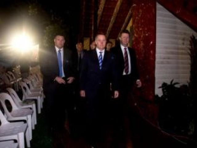 Prime Minister John Key (C) and Labour leader David Cunliffe (R) attend the Waitangi Day dawn service held at the treaty grounds marae at Waitangi. Photo / Dean Purcell