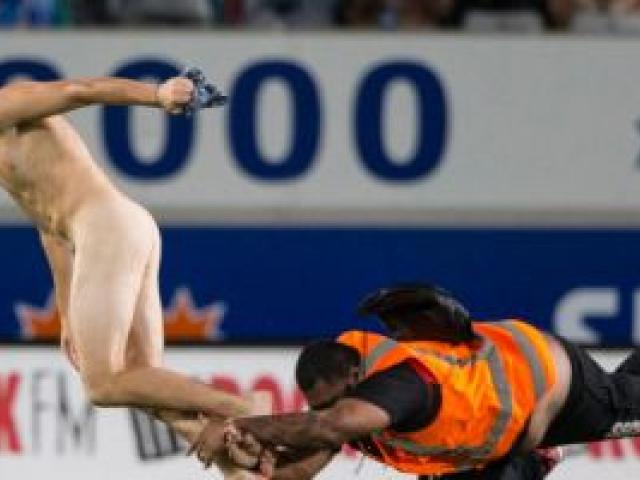 A streaker on the field during the match between the Blues and Highlanders at Eden Park. Photo NZ Herald