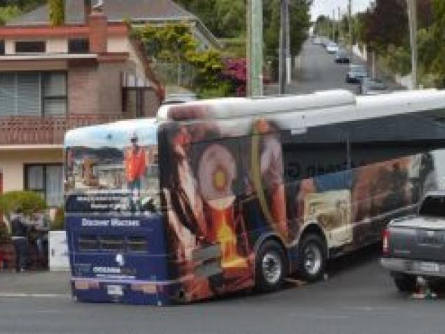 The tour bus ran aground while trying to negotiate a corner into Blacks Rd on Saturday. Photo by Gerard O'Brien.