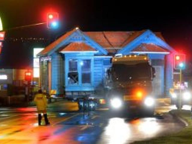 The cottage is shifted along Andersons Bay Rd about 4am yesterday. Photo Stephen Jaquiery
