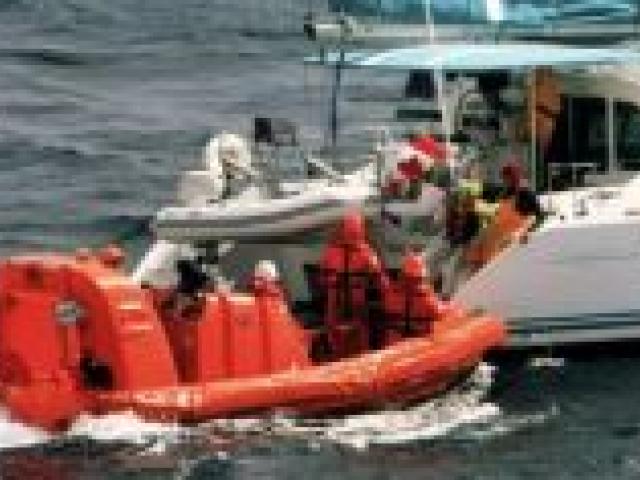 A rescue boat from the Sapphire Princess comes to the aid of crew from Zero Gravity. 