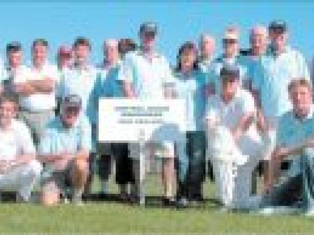 Well-travelled:The Central Otago Wanderers cricket team and supporters on their home wicket at Clyde.