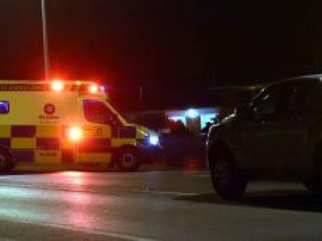 St John staff attend the the scene of an accident last night where an elderly Dunedin man was hit by a car. Photo by Peter McIntosh. St John staff attend the the scene of an accident last night where an elderly Dunedin man was hit by a car. Photo by Peter McIntosh.