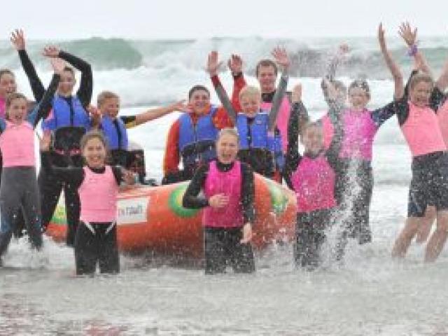 Junior members of the Brighton Surf Life Saving Club celebrate after confirmation yesterday the club has won a $25,000 inflatable rescue boat. Photo by Linda Robertson.