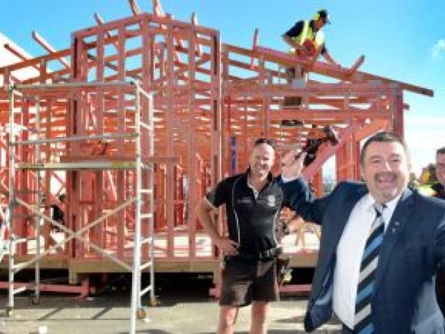 Standing in front of the house to be completed over the next two weekends are (from left) Certified Builders Association of New Zealand  southern region board member Dallas Shaw, Richard Stringer, of Harcourts Dunedin, and Mitre 10 Mega Dunedin chief exec