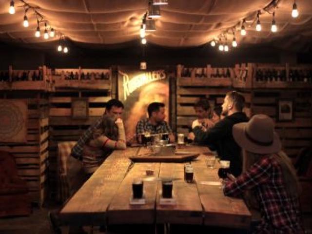 Visitors relax in Ruhstaller Brewery's taproom, Sacramento. Photo by Visit Sacramento.