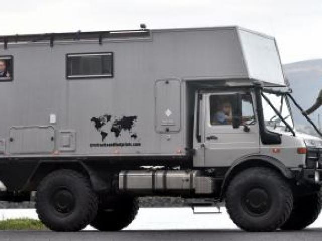 Former Dunedin man Dave Clark stands on his Unimog campervan while his nieces Mikayla (10, left) and Aleisha (13) Wood look out from inside the vehicle. Photo by Peter McIntosh.