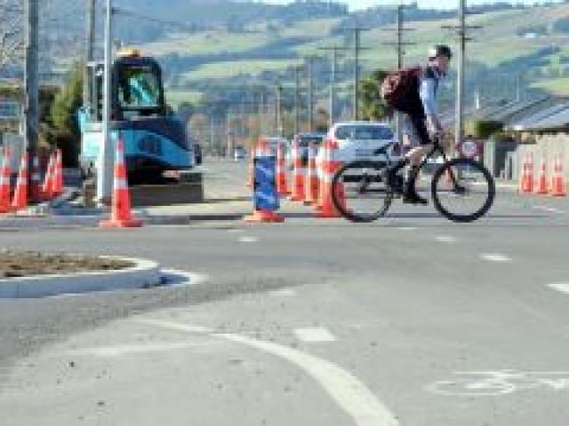 A cyclist crosses at the new roading layout and kerbing on the corner of Factory Rd and Elgin Pl, Mosgiel.  Photo by Craig Baxter.