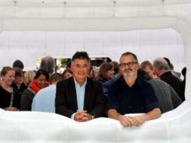 Dunedin Mayor Dave Cull and Dunedin Fringe Festival director Josh Thomas join the crowd gathered in an inflatable cube in the Octagon for the launch of the festival programme last night. Photo by Gregor Richardson.